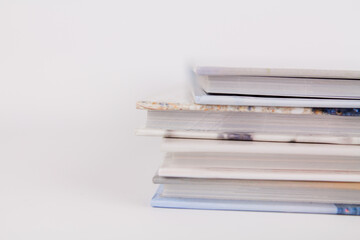 books are in a pile on top of each other on a white background