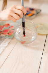 Portrait of a young woman painting at home