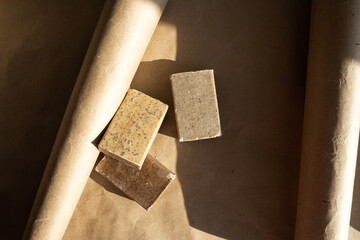 Artisan natural soap bars on craft paper background