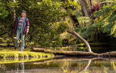 Woman in Terra Nostra botanic garden, travel destination Azores.