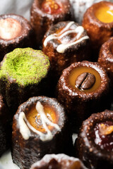 Caneles de bordeaux is a small pastry with rum and vanilla, traditional French sweet dessert.