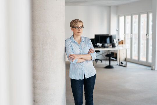 Businesswoman alone in a spacious bright office