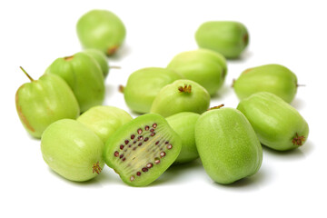 mini kiwi baby fruit (actinidia arguta) on white background 