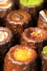 Caneles de bordeaux is a small pastry with rum and vanilla, traditional French sweet dessert.