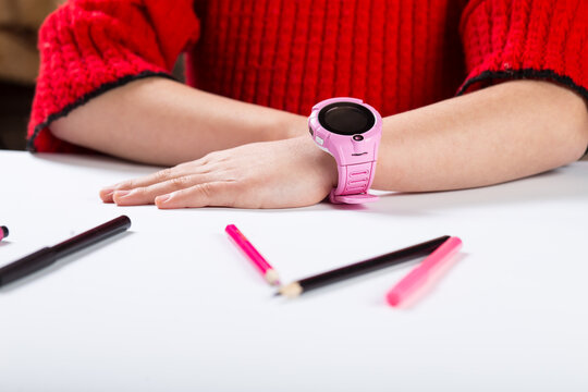 Control leisure time of child. GPS watch for kids. Little girl wearing samrt watch.