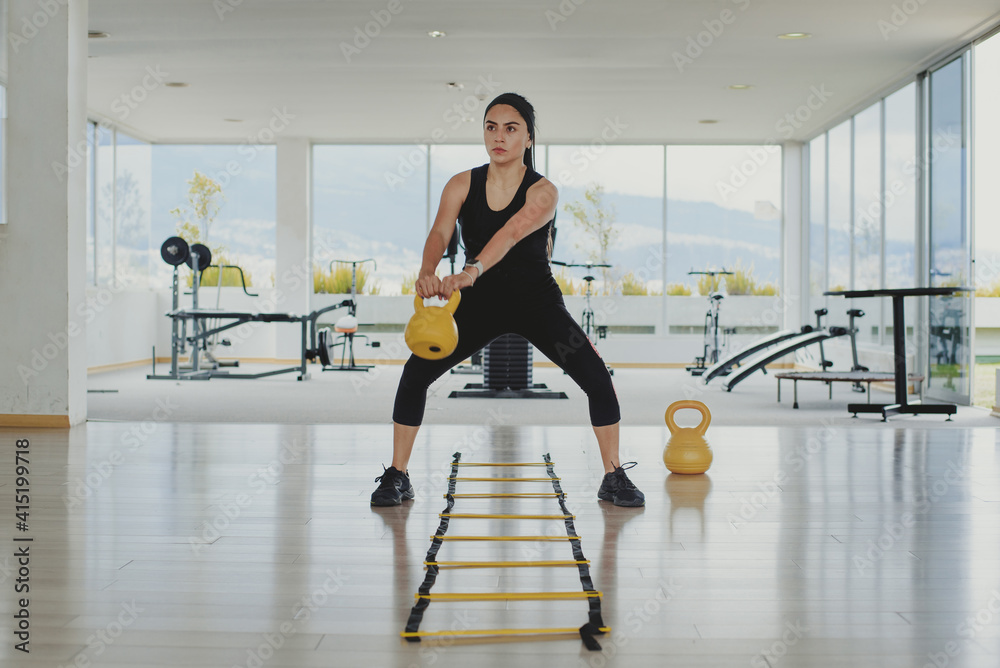 Wall mural woman exercising alone