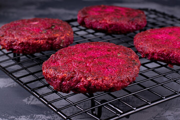 Beet burgers on the metallic lattice. Vegan food
