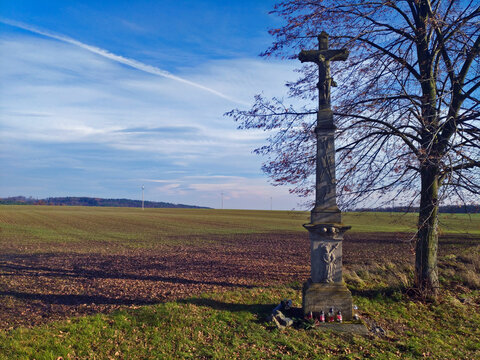 Scenic landscape view with statue of crucifix