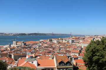 Roofs of Lisbon with bridge in the back Lisbon