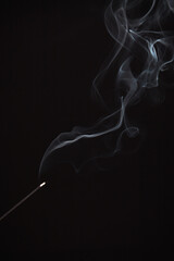 Incense burning giving of different patterns of smoke