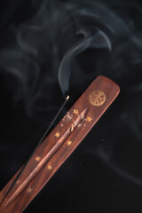 Incense burning giving of different patterns of smoke