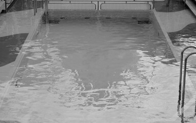 Outdoor pool deck with sun loungers and deck chairs on modern cruiseship or cruise ship liner