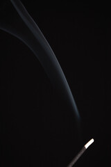 Incense burning giving of different patterns of smoke