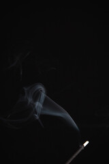 Incense burning giving of different patterns of smoke