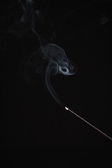 Incense burning giving of different patterns of smoke