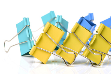 Four binder clips isolated on white background 