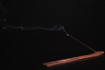 Incense burning giving of different patterns of smoke