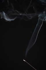 Incense burning giving of different patterns of smoke