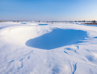 Fototapeta na wymiar winter plain covered by a snow, seasonal outdoor background