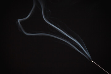 Incense burning giving of different patterns of smoke