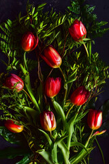 Picture of red tulips on a spell background, beautiful floral bouquet. © kasiaczn
