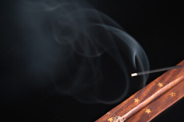 Incense burning giving of different patterns of smoke