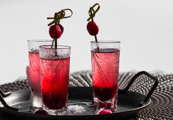 coctail with cranberries on a tray