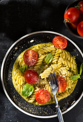 fusilli pasta with tomatoes and basil