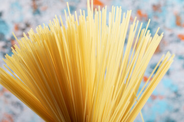 Bunch of spaghetti close-up. Ingredients on the table. Food background. 