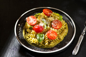 fusilli pasta with tomatoes and basil