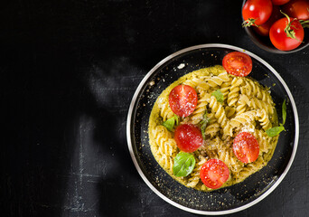 Fototapeta na wymiar fusilli pasta with tomatoes and basil