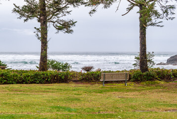Naklejka na ściany i meble A picnic bench with a gorgeous view at Pacific Ocean, British Columbia, Canada.