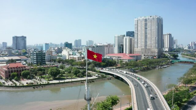 Flight over flag of Vietnam in Ho-Chi-Minh City