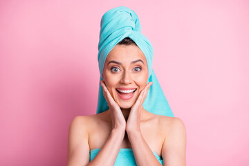 Portrait of impressed nice young lady hands face wear teal bath towels on head body isolated on pink color background