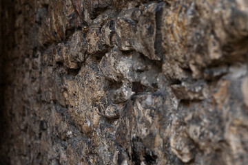 Close up of a brown stone wall.