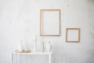 white vintage old interior with vases and frames
