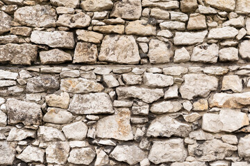 Gray stone wall close up.