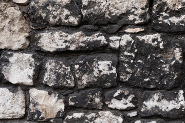 Gray stone wall close up.