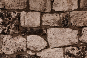 Close up of a brown stone wall.