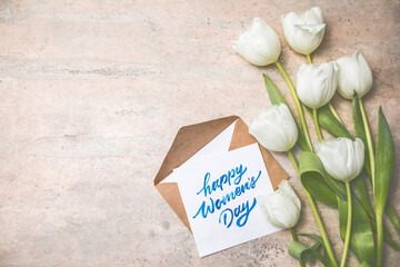 White tulip flowers bouquet on gray background. Flat lay, top view, copy space. Banner for seasonal holiday, springtime concept, International Woman day, 8 march