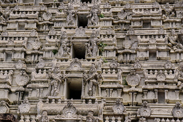 Close-up of ornate Hindu temple tower - Gopuram, with images if Hindu gods, filling the frame, Bull Temple, Bangalore