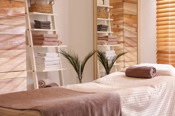 Poster Stylish massage room interior in spa salon © New Africa