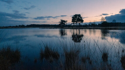 Naklejka premium sunset over lake 2