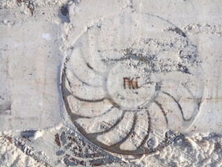 manhole  in snow, sidewalk element, city winter