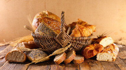 bread and croissant on wood background