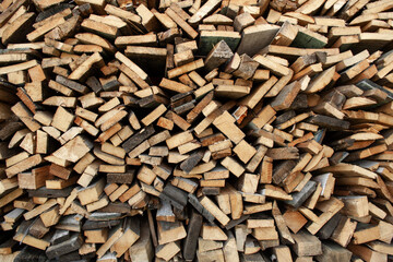 Wood Inside Sawmill. Wide banner or panorama wooden trunks. Sawmill.Natural sawn wood. The texture of the cut. Arranged boards in a sawmill. Harvesting firewood in the village. Pile of planks 