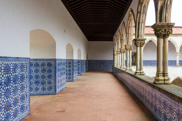 cloister in medieval portuguese monastery with beautiful hand painted tiles on the wall