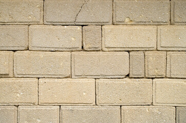 Obraz premium Old ecru stone wall close up