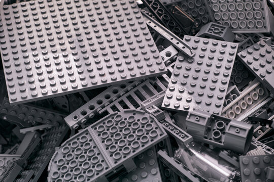 Tambov, Russian Federation - February 05, 2020 Background of gray Lego blocks, bricks, pieces and baseplates.
