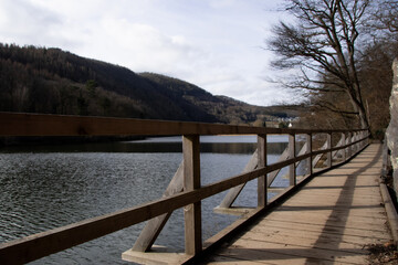 Beautiful hiking trail past the Heimbach reservoir in winter